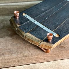 an old book with some copper fittings on it