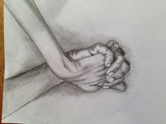 a pencil drawing of two hands holding each other's hand on a piece of paper