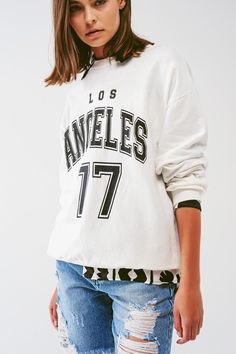 Show off your laid-back style with our Oversized Sweatshirt featuring 'Los Angeles' text in White. This sweatshirt, made from a comfortable blend of 95% cotton and 5% elastane, is perfect for your comfy, casual days. The model, a 5'10" tall with measurements 31-24-35, is wearing a universal size. The sweatshirt boasts a crew neckline, long sleeves, and an oversized fit that provides ultimate comfort. The 'Los Angeles' text on the front adds a touch of urban chic to this classic sweatshirt. Laid Back Outfits, Cozy Loungewear, Oversized Jumper, Sweatshirt Fabric, Oversized Silhouette, Urban Chic, Laid Back Style, Oversized Sweatshirt, Belted Dress