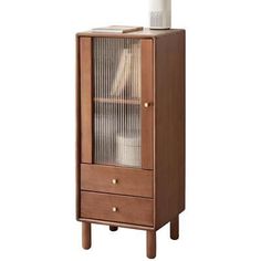 a wooden cabinet with two drawers and a glass door on the bottom shelf, in front of a white background