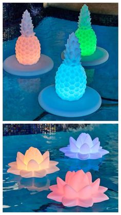 three different colored lights in the shape of pineapples and waterlilies on top of a swimming pool