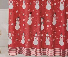 a red shower curtain with snowmen on it