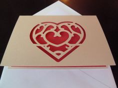 a card with a heart cut out on it