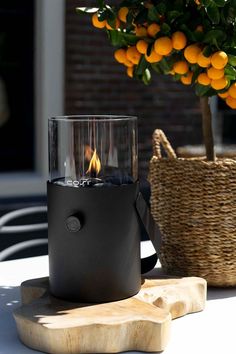 Add a gorgeous warm glow to your garden with the Cosiscoop Fire Lantern from Cosi Fires. This chic Scandi style glass & metal lantern will not only add a pop of colour to your space but will add some warmth and ambient light to your outdoor seating area. #firelantern #lantern Garden Well, Candle Lighter, Glass Fire Pit, Candle Lighters, Fireplace Beam, Tabletop Firepit, Traditional Lanterns, Gas Lanterns, Black Fire