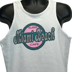 "All Star Cafe Miami Beach Vintage 90s Tank Top T Shirt Florida White Made In USA Graphic Sleeveless Tee Condition: Has image fading. See photos. Size and Measurements: Mens/Unisex Medium Width 20.5\" - Underarm to underarm Length 25.5\" - Measure from top of shoulder at the edge of collar to the bottom of the shirt" 90s Tank Top, Star Cafe, Beach Tanks Tops, Beach Vintage, Beach Tanks, Beach Cafe, Sleeveless Tee, Top T Shirt, Workout Tank Tops