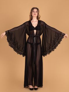 Ankle/floor-length seductive style with a long front slit starting at the waist. Sewn-in elastic waist belt ties into a sash. Material Composition: polyester 100% Pretty Nightgowns, Silk Robe Long, Robe For Women, Lace Bridal Robe, Seductive Style, Luxury Robes, Sheer Robe, Peignoir Sets, Chiffon Kimono