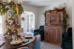 the dining room table is set for christmas dinner