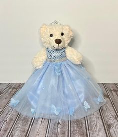 This powder blue sequin, tulle, and 3D Butterfly Princess, Quinceanera Teddy Bear gown with gold or silver rhinestone waistband is handmade with premium fabric and hook n loop closure in the back for easy on and off. This teddy bear gown is a great Birthday, Christmas, Flower girl, Hanukkah, Valentine Day, Quinceanera, Quince, Easter gifts, or just because gifts for any child or doll collector. Measurement is from shoulder to bottom of dress 15in, and waist is 11in. 15-inch Teddy bear gown and 14in bear  All of the crown, props and Shoes in photos are not for sale, unless otherwise noted. The dresses are modeled on a 14in bear and fit perfect! The clothes are sewn with good quality fabric in my smoke and cat free environment with swift shipping! Handmade in USA Thank you for stopping by an Blue Glitter Tulle Gown For Wedding, Blue Glitter Tulle Ball Gown, Blue Glitter Tulle Princess Dress, Light Blue Tulle Pageant Dress For Wedding, Quinceanera Teddy Bear, Rhinestone Gown, Butterfly Princess, 3d Butterfly, 3d Butterflies