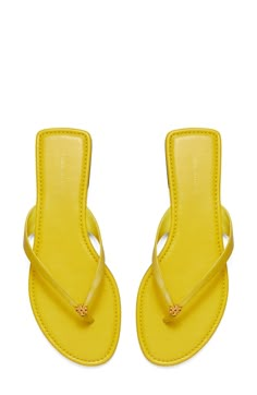 Signature logo hardware details the toe post of a versatile flip flop that will complement your warm-weather style. Flat sole Leather or synthetic upper/leather lining and sole Imported Trendy Yellow Flat Flip Flops, Brown Flat-heel Summer Flip Flops, Summer Vacation Sand-colored Flip Flops, Yellow Tory Burch Sandals, Tory Burch Flip Flops, Yellow Sandals, Cute Shoes Heels, Trendy Fits, Leather Flip Flops