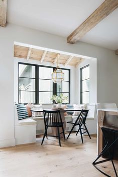 a dining room table with four chairs around it