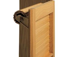 a close up of a wooden door with a latch on the front and side panels