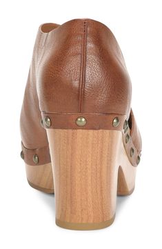 A half d'Orsay upper adds unique style to this 60s inspired clog. 2.5" heel, 1" platform Round toe Stud details Slip-on Wood heel Manmade upper and sole Imported Extreme High Heels, Short Grey Hair, Closed Toe Shoes, Wood Heel, Asymmetrical Design, Women's Pumps, Nordstrom Rack, Block Heels, Clogs