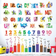 the alphabet wall decals are colorful and have animals on them, as well as crayons