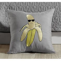 a pillow with a cartoon banana on it