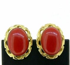 Vintage 1960s Italian earrings, in solid 18K yellow gold, professionally tested and hallmarked 750, with a natural red Mediterranean coral shuttle. Dimensions 2 x 1.6 centimeters. Total weight 11.4 grams. Sold with our vintage jewelry packaging, receipt and guarantee. Retro Yellow Gold Formal Earrings, Retro Red Formal Earrings, Retro Red Earrings For Formal Occasion, Red Retro Earrings For Formal Occasions, Retro Red Clip-on Earrings For Formal Occasions, Formal Red Oval Earrings, Red Oval Earrings For Formal Occasions, Antique Red Earrings For Anniversary, Mid-century Yellow Gold Formal Jewelry