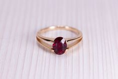 Gold ring (14k) with Ruby (Lab). : Main gemstone: Ruby (Lab) Metal: Solid Gold 14K : * If desired, we can replace the main gem with any of the following: Amethyst, Alexandrite, Citrine, Emerald, Garnet, London Blue Topaz, Sky Topaz, Peridot, Smoky Quartz, Sapphire, Ruby. * If the required gem stone is not on the list, feel free to let us know which of the precious stones you would like to be set in * If you prefer, this piece of jewelry can be made with sterling silver (22k), yellow gold, rose g Gold Ring With Ruby, Ruby Promise Ring, Ruby Birthstone Ring, Ring With Ruby, Ruby Birthstone, Ring Ruby, Ring Ideas, Ruby Gemstone, 14k Gold Ring