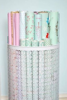 several different types of wrapping paper in a holder