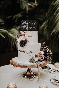 a wedding cake sitting on top of a table