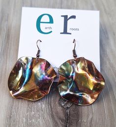 These boho style earrings feature copper discs that are 1.5" in diameter and have been fire painted using a propane torch to bring out the different colors in the metal when heated. NOTE:  Certain lighting will make the colors pop more than other types of lighting. These earrings will ship in a gift box via USPS with tracking info provided. Artsy Nickel-free Copper Earrings, Nickel-free Multicolor Copper Earrings, Multicolor Nickel-free Copper Earrings, Artsy Gold Earrings Made Of Copper, Artsy Gold Copper Earrings, Propane Torch, Fire Painting, Boho Style Earrings, Types Of Lighting