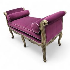 a purple chair with gold trim on it