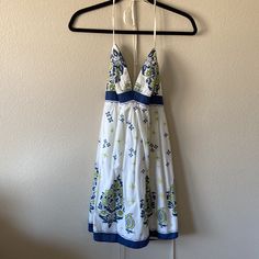 Euc Perfect Condition Nwots Teeze Me Adorable Sundress White With Blue And Lime Green Patterns And Specs Of Silver Glitter Ties In Back Has Light Lining On Top If You Don’t Want To Wear A Bra ! Bottom Lined Too Size7 Measured 14.5” Inches Pit To Pit Waist 12.5” Inches Flat Hips 18” Inches Flat Length 32”Inches Brown Cotton Dress, Sundress White, Midi Prom Dress, Green Patterns, Wrap Dress Long Sleeve, Wrap Dress Long, White Halter Top, Sleeveless Knit Dress, Wear To Work Dress