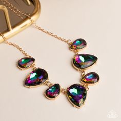 Featuring a stellar iridescence, an oversized collection of glittery oil-spill teardrop gems alternates upside down and right-side-up below the collar for an out-of-this-world sparkle. Features an adjustable clasp closure. Due to its prismatic palette, color may vary. Sold as one individual necklace. Includes one pair of matching earrings. Paparazzi Earrings, Brown Bracelet, Oil Spill, Palette Color, Jewelry Images, Paparazzi Accessories, White Necklace, Pink Ring, Paparazzi Jewelry