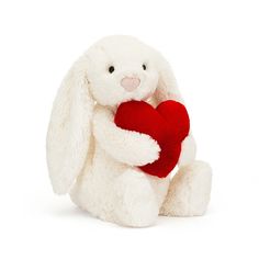 Your soft-hearted friend A classic gift to share love and joy with iconic Bashful Bunny. This cloud-soft bunny has cream fur, flopsy ears and a pink suedette nose. Holding a sumptuous cranberry heart, this Bashful Bunny gives incredible hugs, from Valentine's Day to a special anniversary.      Medium: H12" X W5"  Small: H7" X W4"   From the creators of the softest stuffed animals you have ever hugged, cuddled and adored. Established in London in 1999, there is always something original and quirky yet incredibly soft and sumptuous to find at Jellycat! Irresistibly cuddly, sophisticatedly silly, hilariously humorous, a perfect gift for all ages! SAFETY & CARE    Tested against and passed ASTM requirements. Suitable from birth. Hand wash only; do not tumble dry, dry clean or iron. Not rec Bunny Soft Toy, Red Love Heart, Red Love, Newborn Gifts, Christmas Wishlist