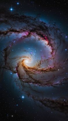 two spiral galaxy like objects in the sky with stars around them and blue, purple, and red hues