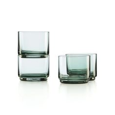 three glasses sitting next to each other on a white surface