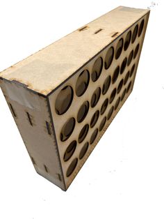 an object made out of cardboard with holes in the middle and one hole at the top