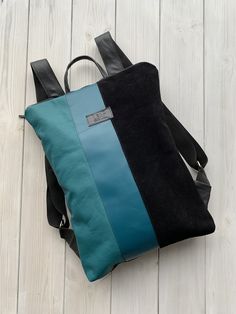 "Ethically made light and comfortable upcycled leather colourful bagpack. Backpack is made from finest leather. I can guarantee that you won't find the same backpack, it's totally one of a kind. Backpack fits 15\" laptop. BACKPACK FEATURES | One zipped and one open pocket inside | Key holder inside | Lining SIZE: 32 x 42 cm (12.6 x 16.5 in) You can choose convertible backpack plus leather purse. Pouch is perfect for your cosmetics, laptop charger or to use it as evening bag. It is made from the Blue Rectangular Leather Backpack, Blue Leather Backpack For Everyday Use, Blue Leather Satchel Backpack, Modern Blue Leather Backpack For Everyday, Modern Everyday Blue Leather Backpack, Blue Leather Backpack For Daily Use, Blue Leather Rectangular Backpack, Blue Leather Travel Backpack, Modern Blue Leather Backpack With Adjustable Strap