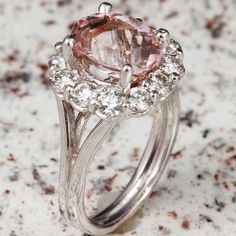 3.70 Carats Exquisite Natural Morganite and Diamond 14K Solid White Gold Ring Suggested Replacement Value: 6,500.00 Total Natural Morganite Weight: Approx. 2.35 Carats Morganite Measures: Approx. 10.00 x 8.00mm Natural Round Diamonds Weight: Approx. 1.20 Carats (color G-H / Clarity SI1-SI2) Ring total weight: 6 grams Disclaimer: all weights, measurements and colors are approximate and may vary slightly from the listed dimensions or as seen in the image. All pictures are magnified to show the sma Luxury Morganite Diamond Ring With Prong Setting, Heirloom Morganite Diamond Ring For Formal Occasions, Formal Morganite Diamond Ring, Formal Morganite Diamond Ring Fine Jewelry, Luxury Morganite Diamond Ring For Anniversary, Oval Gemstones With Halo Setting For Formal Occasions, Formal Morganite Diamond Ring In Fine Jewelry Style, Exquisite Formal Morganite Ring, Luxury Pink Gemstones For Wedding