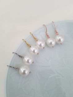 Gold, Silver or Rose Gold 10mm swarovski pearl earrings Matching necklace; https://www.etsy.com/listing/233080328/bridesmaid-necklace-gold-necklace-with Elegant Pearl Earrings For Wedding And Mother's Day, Pearl Drop Earrings For Wedding On Mother's Day, Hypoallergenic Round Pearl Beads Earrings For Wedding, White Round Bridal Earrings For Bridesmaid Gift, White Bridal Earrings For Bridesmaid Gift, White Round Bridal Earrings For Bridesmaid, White Round Beads Pearl Earrings For Wedding, White Pearl Earrings With Round Beads For Wedding, White Pearl Earrings For Wedding With Round Beads