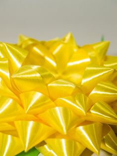 a bunch of yellow bows on top of each other