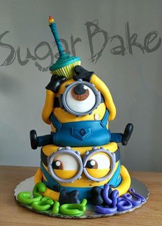 a cake that is decorated to look like a minion