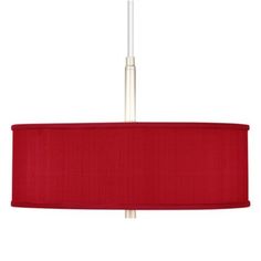 a red lamp shade hanging from a ceiling fixture