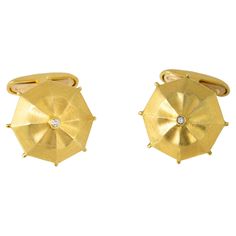 "Costis" Umbrella Collection Cufflinks Yellow Gold with 0.04 carats Diamond on the center. Cufflinks, hand-crafted 18K Yellow Gold, and a 0.04 carat Diamond set on the center of the umbrella. A piece of jewelry for men! If one could encapsulate Costis’ work in one word, that word would be "different”. Costis loves to observe nature; the sea, the flowers, the animals, the world we live in. These are the forms he re-creates through his jewelry, by enhancing the sculptural element in any object; by Jewelry For Men, Diamond Set, One Word, Everyday Objects, Everyday Items, The Animals, The Ordinary, The Sea, Cufflinks