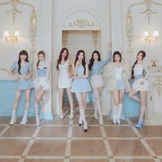 girls'generation posing in front of a blue and white wall