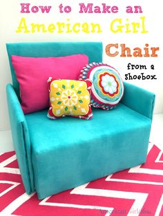 a blue chair with colorful pillows on it and the words how to make an american girl chair from a shoebox