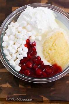 marshmallows, cranberry sauce and sour cream in a glass bowl