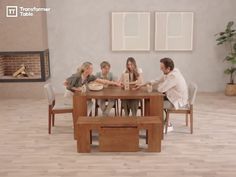 a group of people sitting around a wooden table