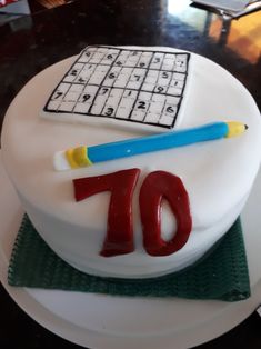 a birthday cake with a keyboard and pencil on it