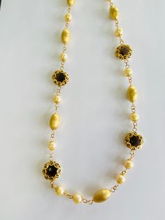 "This is a vintage 18K (high-karat) yellow gold, brown/smokey topaz, and pearl necklace. The necklace pattern alternates from a smooth-textured gold beads, to pearls, to ornately gold-wrapped brown/smokey topaz. Material(s): 18K yellow gold + pearl + brown/smokey topaz Total weight: 45 grams Flaws (if any): None to mention Marking(s): \"750\" (translating to \"18K\") + \"Italy\" Measurements: This necklace measures 23 1/2 (or 23.5) inches in length. If you have any questions about this necklace, Heirloom Gold Jewelry With High Luster, Heirloom High Luster Gold Jewelry, Heirloom High-luster Gold Jewelry, Classic Gold Gemstone Necklace, Classic Gold Necklace With Gemstone, Heirloom Gold Gemstone Necklace, Vintage Gold Necklace With High Luster, Vintage Gold Necklaces With High Luster, Classic Handmade Gold Necklace