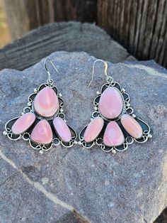 Add a touch of oceanic beauty to your look with our Pink Conch Shell Daggling Fan Earrings! Made from genuine pink conch shell, these earrings feature a unique daggling fan design that will catch everyone's eye. Perfect for adding a pop of color and personality to any outfit. Fan Design, Fan Earrings, Kids Earrings, Conch Shell, Pop Of Color, Barbie Girl, Conch, Earring Necklace, Vintage Watches