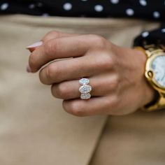 a close up of a person wearing a ring