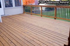 a wooden deck in front of a house with the words twp cedarone natural on it