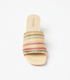 Conquer your day with ease with these raffia slides that strike the perfect balance between a walkable heel height and on-trend style. This design features padded OrthoLite Hybrid insoles and a patented down curve, ensuring a natural and comfortable stride with arch support. The raffia material adds a hint of texture and a bohemian charm, making these sandals a versatile addition to your wardrobe. Raffia upper Heel height: 2 3/4 inches Imported True to size Seychelles | Karen Kane Adapt Raffia H Spring Slip-on Heels With Woven Sole, Multicolor Round Toe Mules For Summer, Spring Beach Straw Mules, Spring Straw Mules, Multicolor Open Toe Mules For Summer, Spring Beige Straw Mules, Spring Vacation Straw Mules, Spring Beach Mules With Open Heel, Trendy Multicolor Mules For Spring