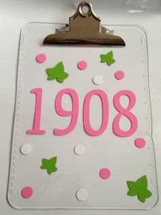 a clipboard with pink and green polka dots on it that says'1088 '