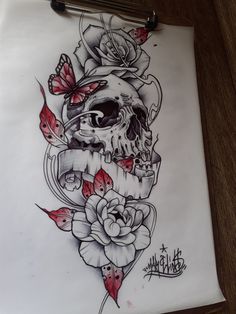 a drawing of a skull with roses and butterflies on it's head, sitting on top of a piece of paper