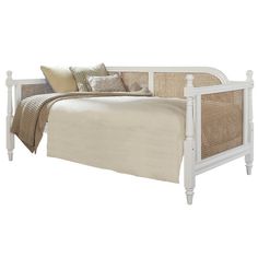 a white day bed with wicker headboard and foot board, made in the usa